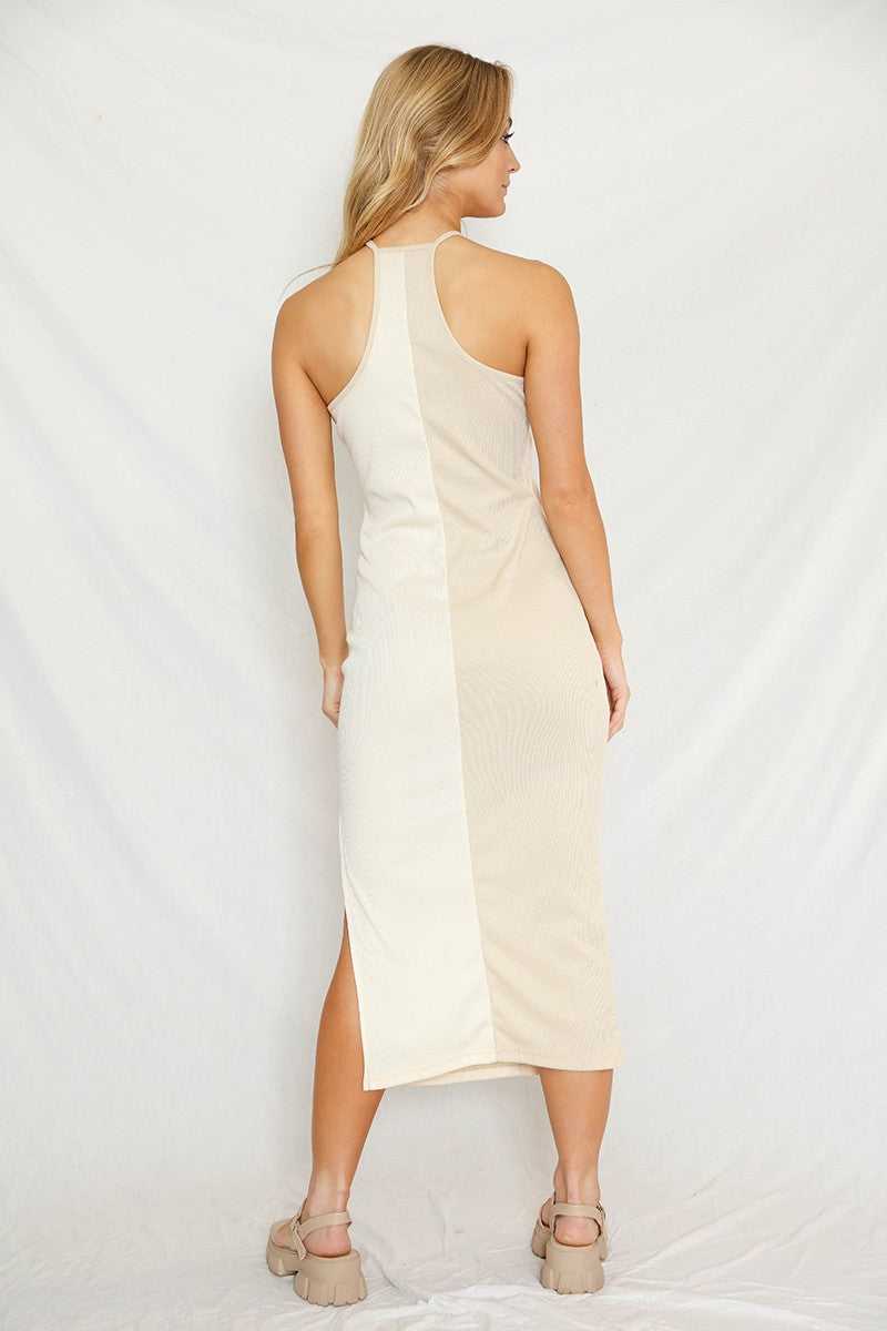 Color Block Halter Dress Side Slit in rib knit fabric featuring a beige and peach color block design. Midi length with halter neckline and side slit.