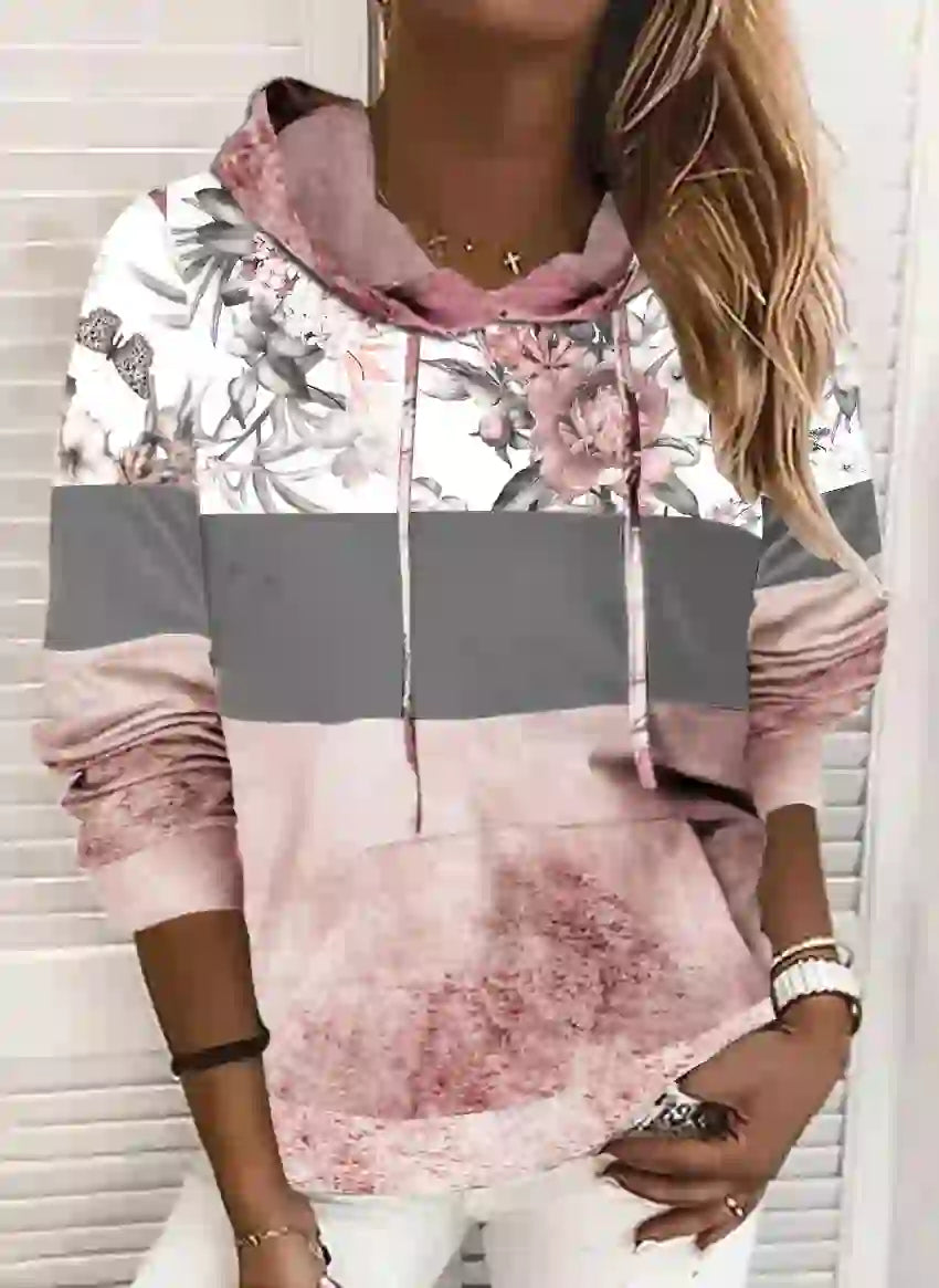 Stylish women's Hooded Printed Fleece Sweatshirt with floral print and ombre pink fade, perfect for layering in trendy fashion outfits.