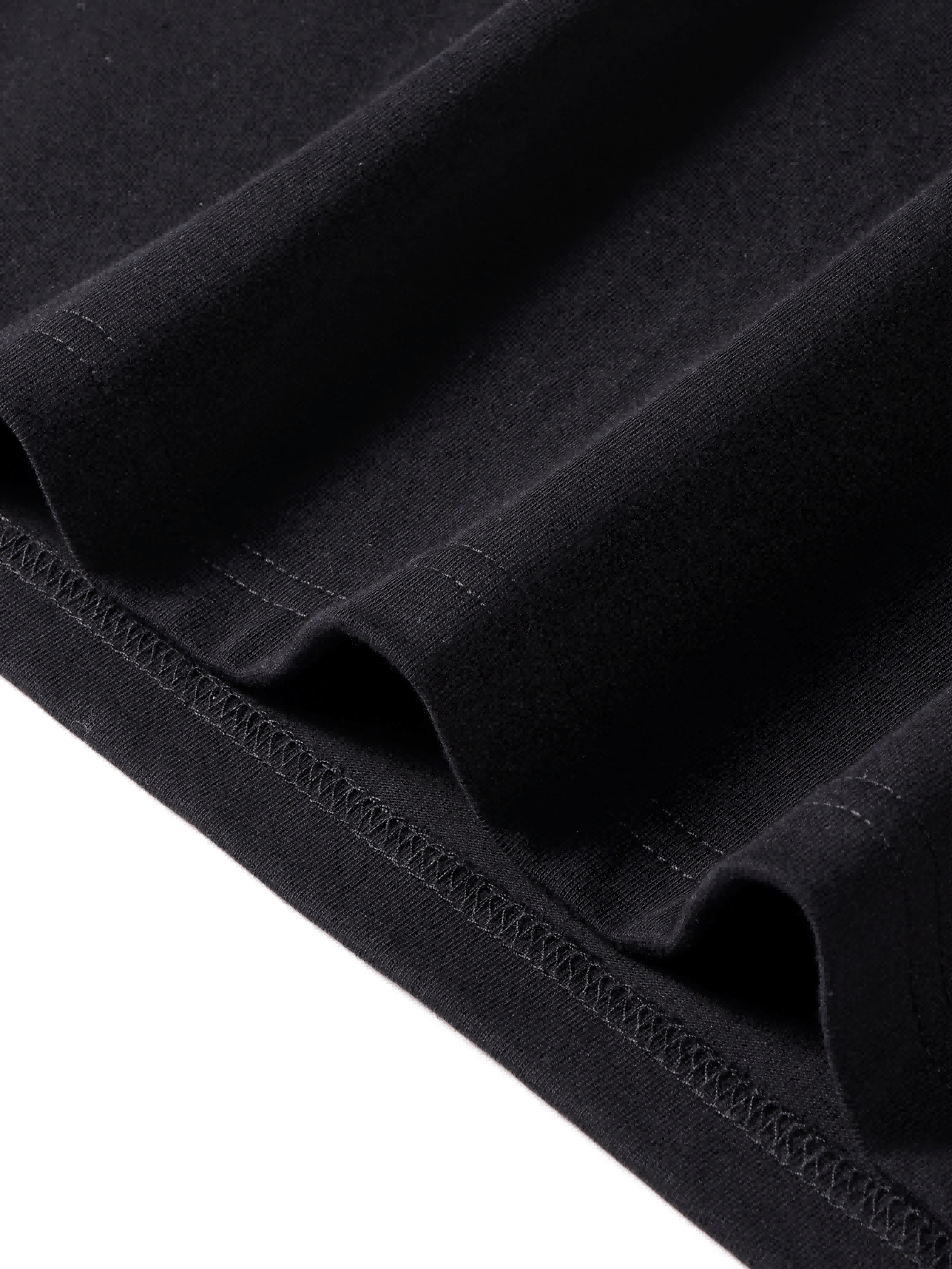 Close-up of the hem stitching on the Hello Kitty Pink Bow Black Graphic Women's T-shirt, highlighting the quality cotton fabric and neat finish.