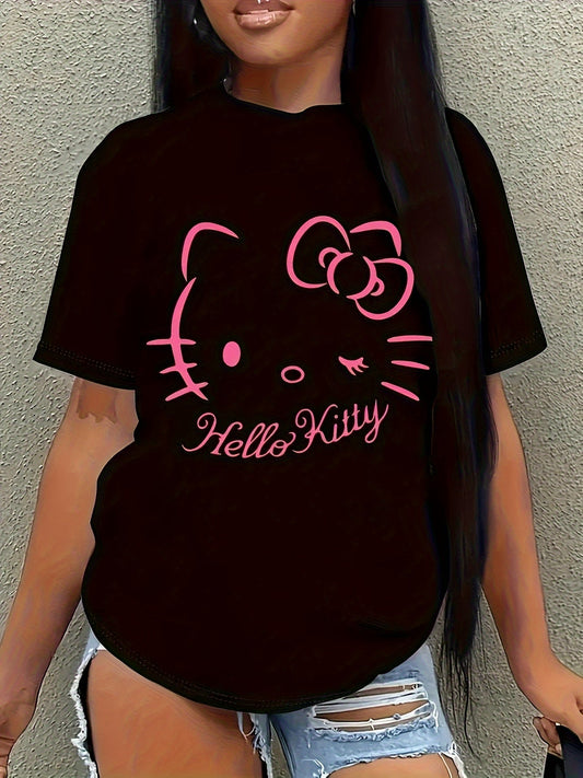 Hello Kitty Pink Bow Black Graphic Women's T-shirt featuring a large pink Hello Kitty face and logo on the front, styled with ripped denim shorts.