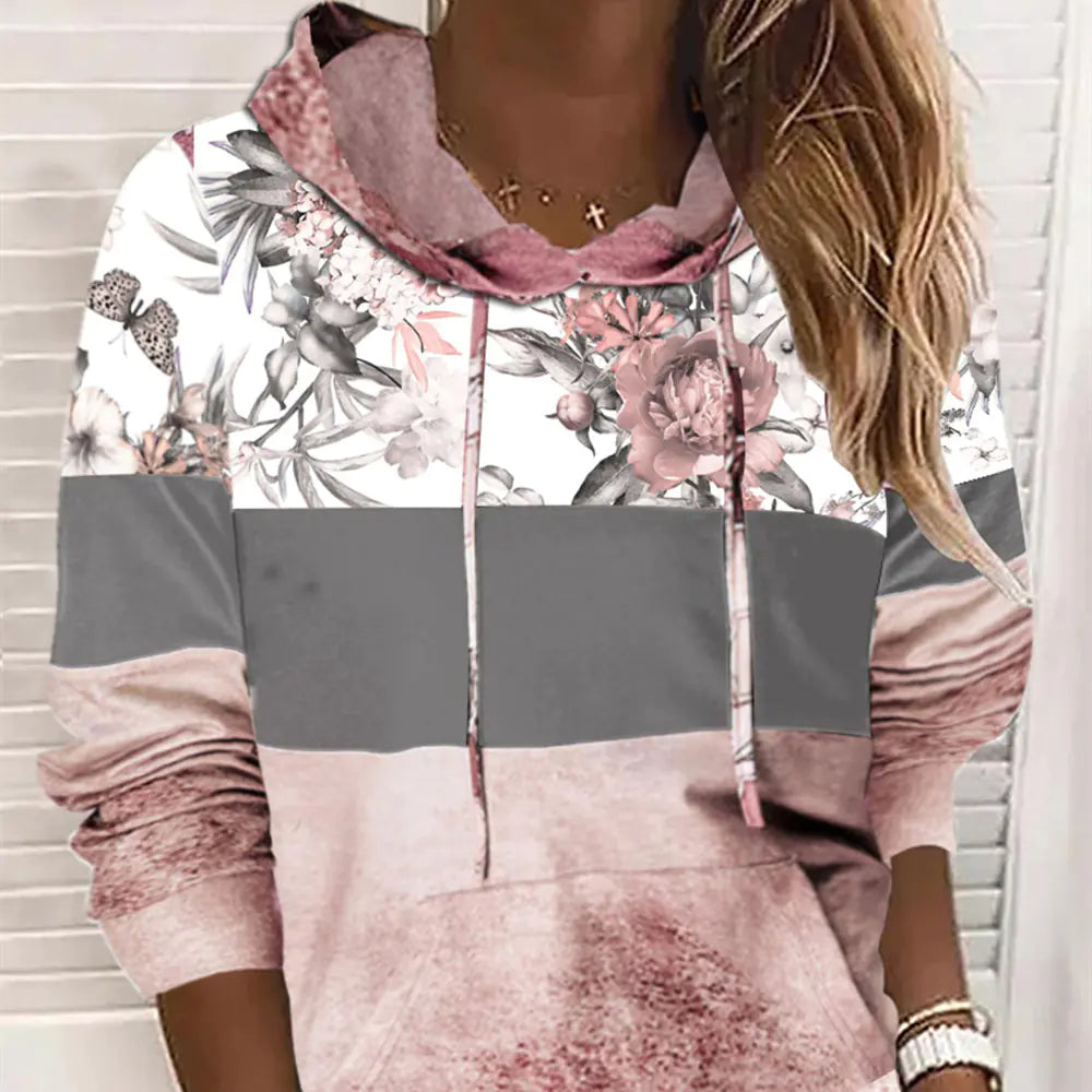 Close-up of Hooded Printed Fleece Sweatshirt showing floral print and soft fleece texture, ideal for stylish women's casual wear.