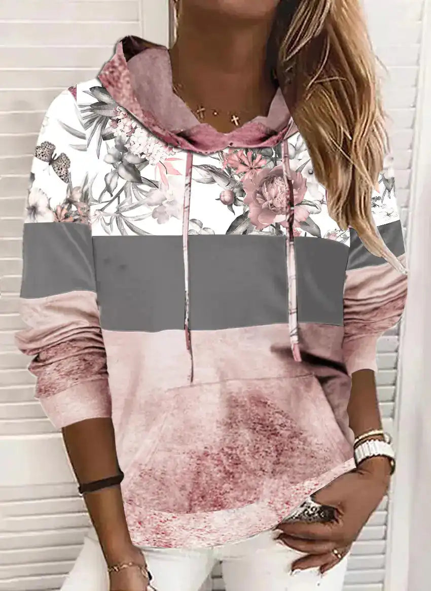 Hooded Printed Fleece Sweatshirt with kangaroo pocket and drawstring hood, combining floral and gradient patterns for a cozy, modern look.